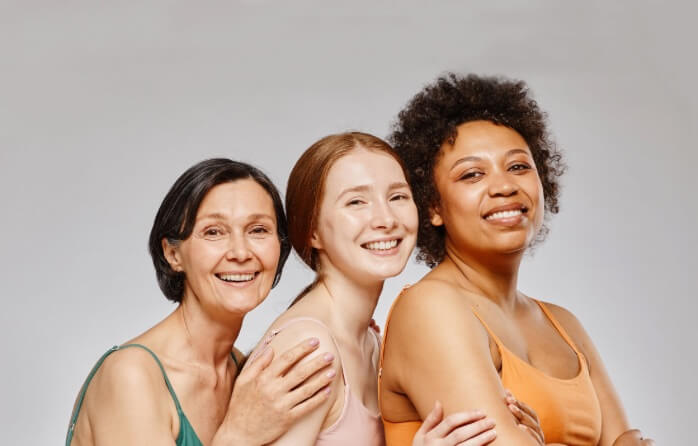 diverse group of 3 women smiling